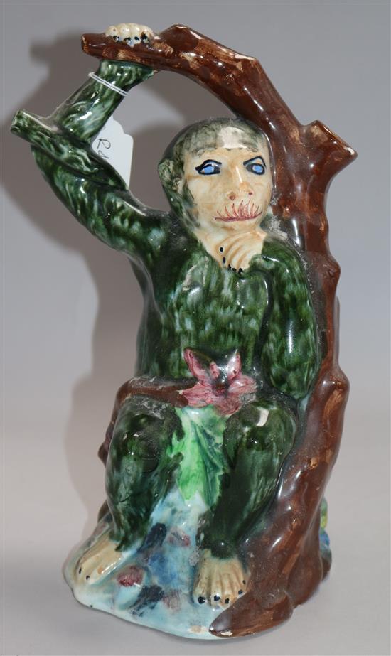 A French ceramic monkey and tree flagon 28cm